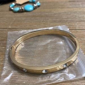Gold Finish bracelet with 10 individual diamond like stones